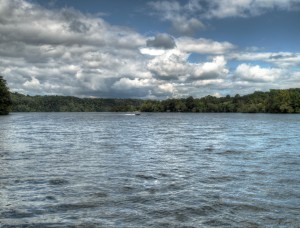 View of watts bar lake in east tennessee on cloudy day with boat in the distance on waves