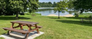 Norris lake water front park with picnic bench on sunny day